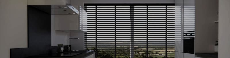 Black Venetian blinds across a kitchen window
