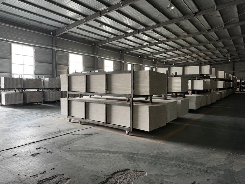 Finished white shutter panels racked on trolleys before packing