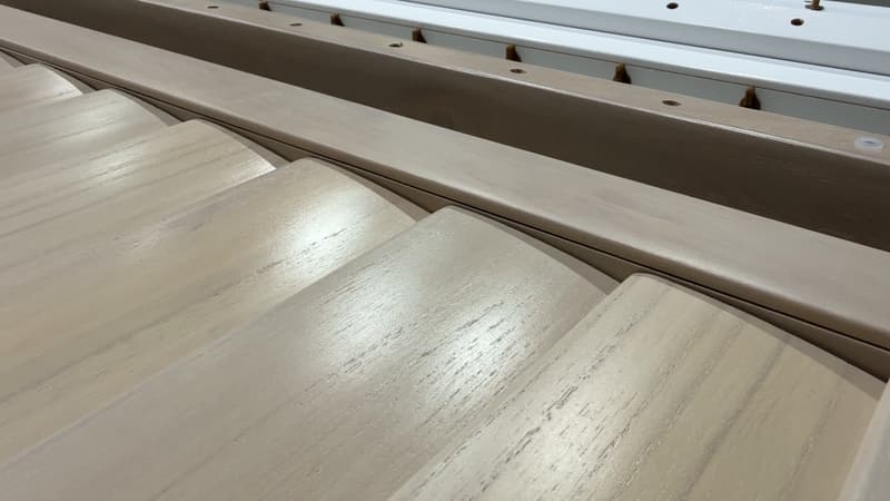 Close-up of stained timber louvres fitted into a shutter panel