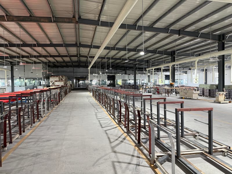 The shutter factory floor, with assembly benches and finishing lines in daylight